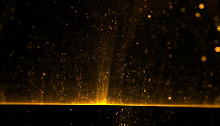 Gratis Foto gouden glitterdeeltje dat barst van de lichtstraal