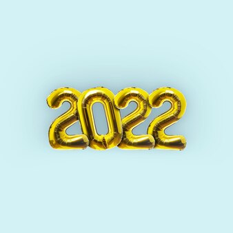 Gouden vakantie ballonnen nieuwjaar 2022 op een lichtblauwe achtergrond. oudejaarsavond 2022. creatief idee