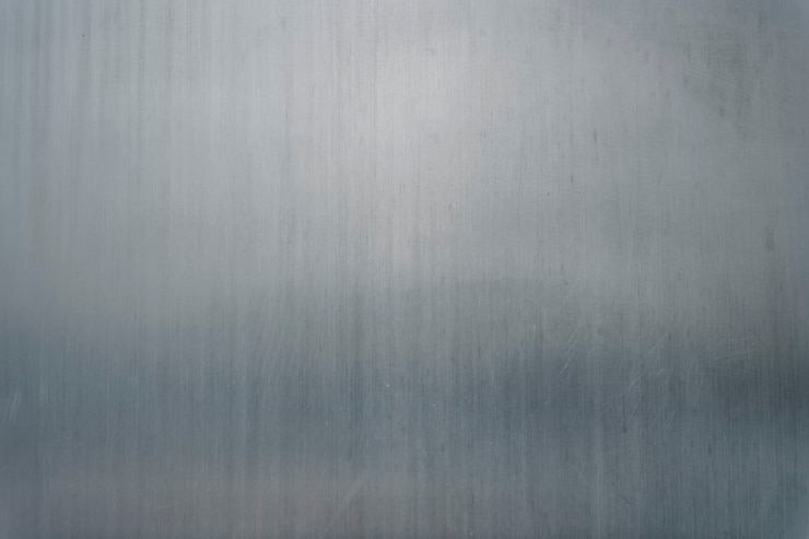 Gratis Foto grijze achtergrond met fijne metalen textuur