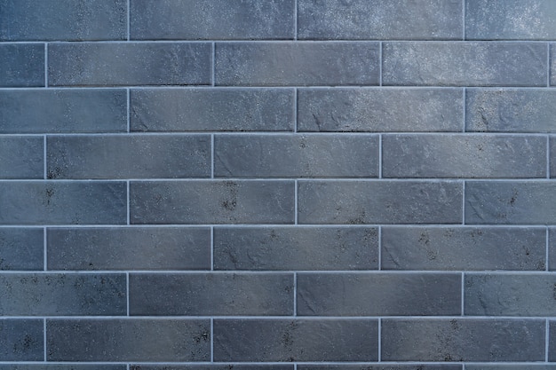 Gratis foto grijze bakstenen muur. het patroon van baksteen met witte vulling