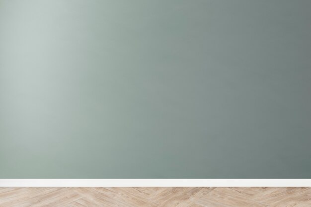 Groene lege betonnen muur mockup met een houten vloer