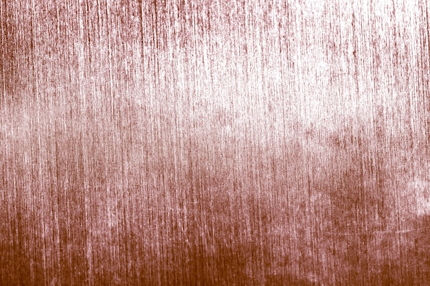 Grunge vervaagde roze goud getextureerde achtergrond