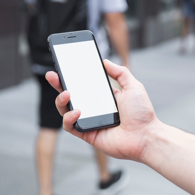 Hand met hand en smartphone bijsnijden