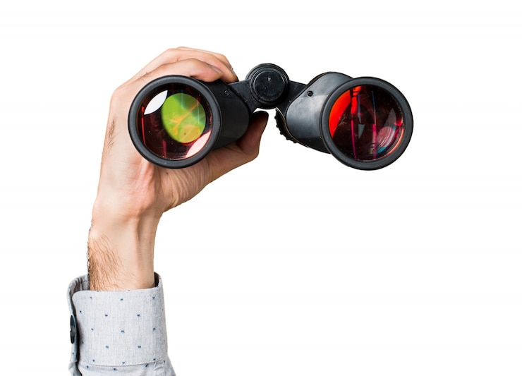 Gratis Foto hand van de mens met een verrekijker