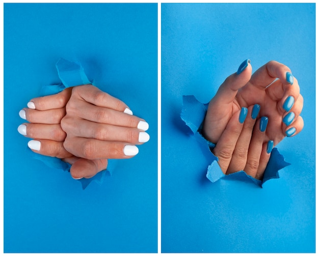Handen met blauwe en witte nagels