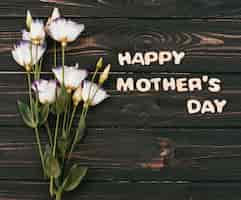 Gratis foto happy mothers day inscriptie met bloemen boeket