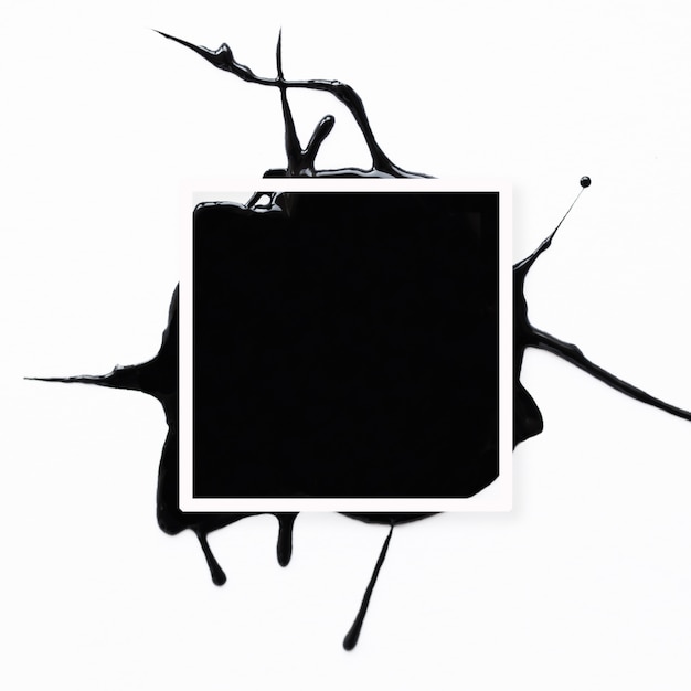 Het abstracte frame met zwart ploetert op wit