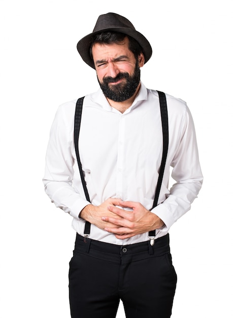 Hipster man met baard met buikpijn