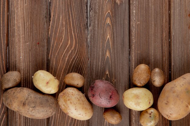 Horizontale weergave van aardappelen op houten achtergrond met kopie ruimte 2