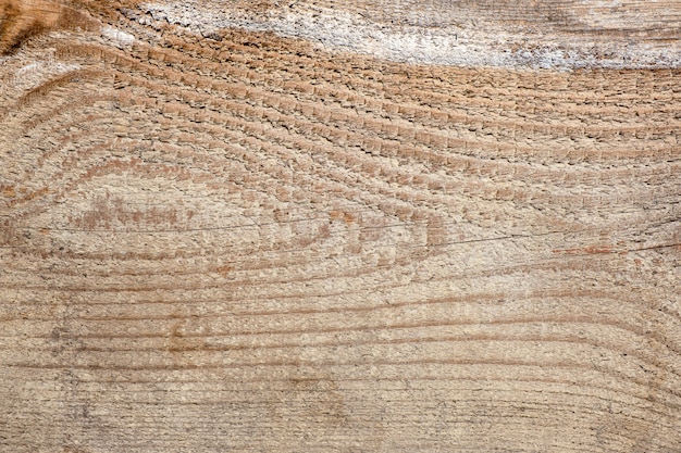 Houten achtergrond met horizontale lijnen en oogvormige knoop