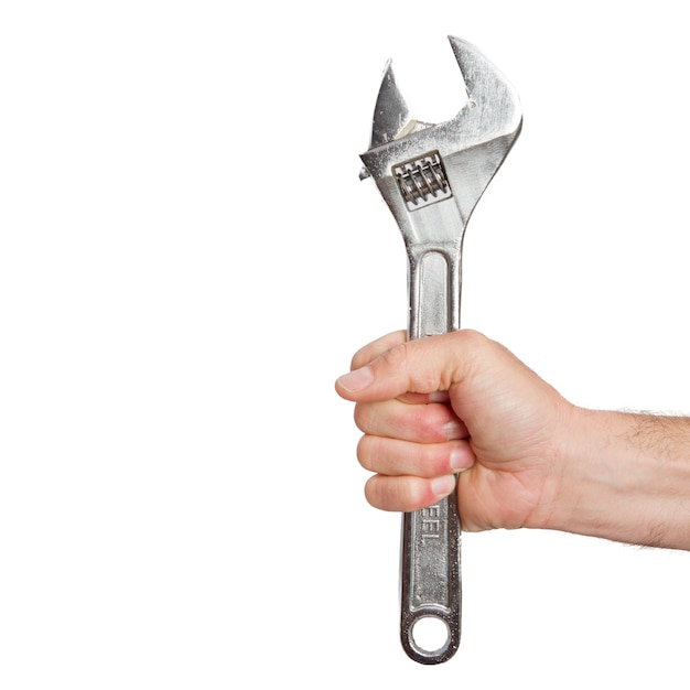 Iemands hand holding spanner