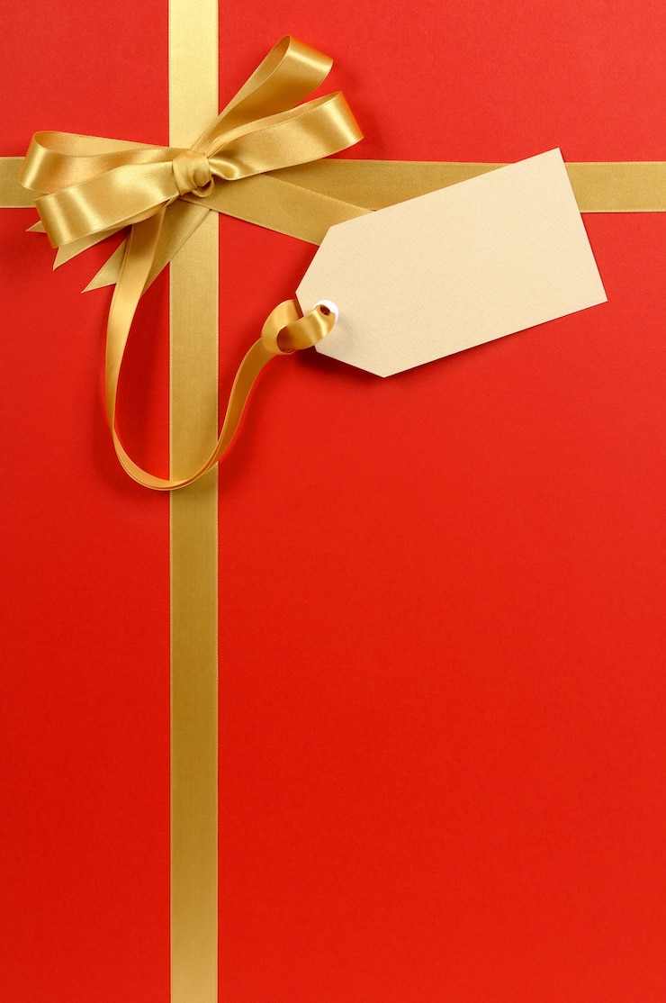Gratis Foto kerst cadeau achtergrond met cadeau-tag