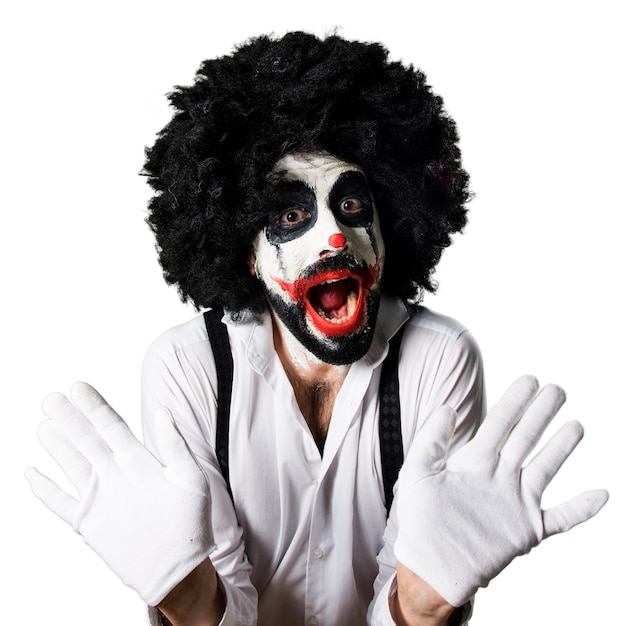 Gratis foto killer clown maakt verrassingsgebaar