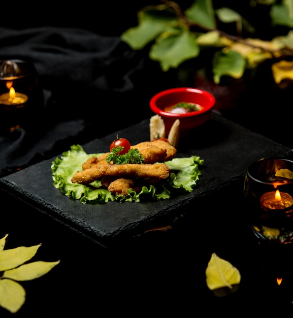 Kippenschnitzel met tomaat en groen