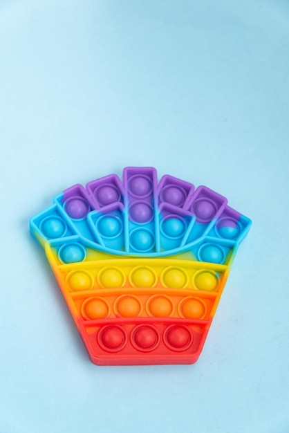 Gratis foto kleurrijk pop-it-speelgoed over achtergrond - close-up