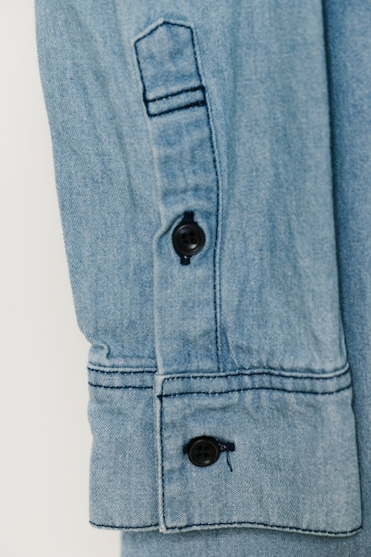 Gratis foto lichtblauwe denim mouwclose-up