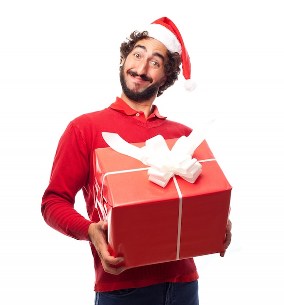 Man met hoed van de Kerstman en een cadeau
