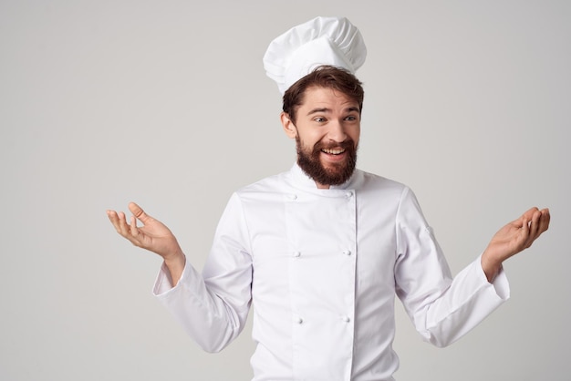 Mannelijke kok restaurant service professionele handgebaar geïsoleerde achtergrond. hoge kwaliteit foto