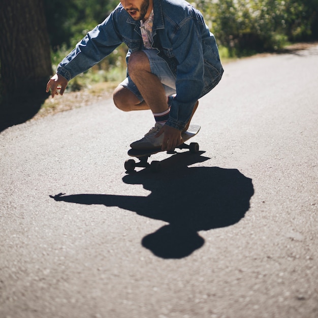 Medium shot man skateboarden