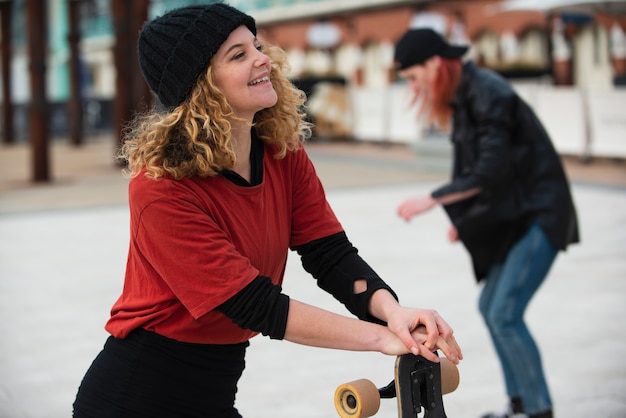 Medium shot smiley skater dames