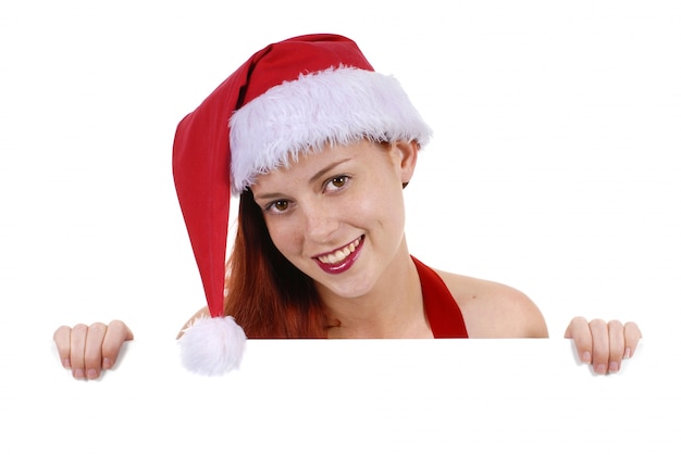 Meisje in Santa outfit op zoek over billboard