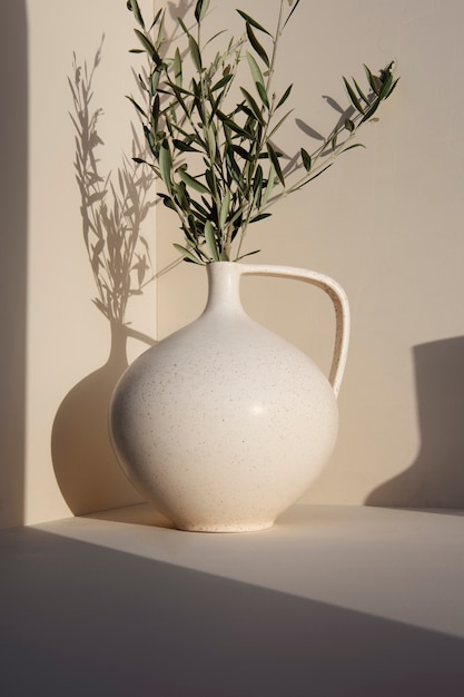 Gratis foto minimale witte vaas met planten