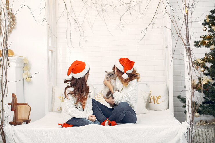 Gratis Foto moeder met schattige dochter zittend op een bed
