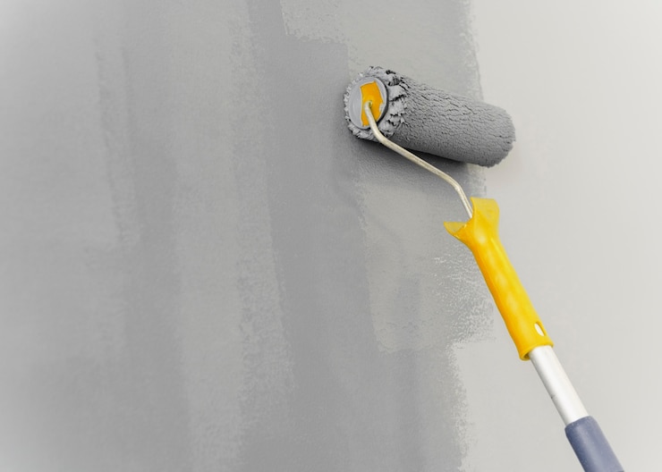 Gratis Foto muurschildering met roller concept