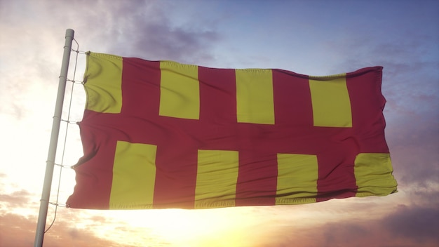 Northumberland vlag, engeland, zwaaien in de wind, lucht en zon achtergrond. 3d-rendering Premium Foto