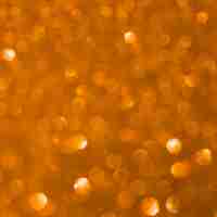 Gratis foto ongericht oranje glitter achtergrond