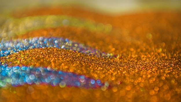 Oranje en blauw glitter bokeh lichten achtergrond