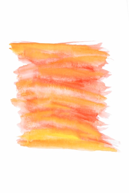 Oranje en gele aquarel penseelstreken op wit papier