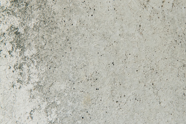 Gratis foto oude grijze muur, grunge betonnen achtergrond met natuurlijke cement textuur.