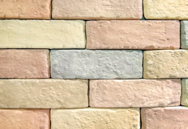 Pastelkleurige bakstenen muur gestructureerd behang