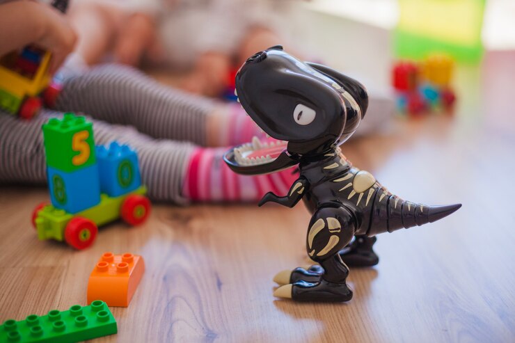 Gratis Foto plastic dinosaurus op de vloer