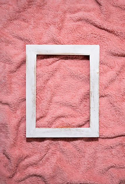 Platliggend frame op roze deken