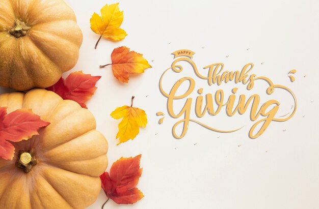 Platliggende Thanksgiving-dag met pompoenen en bladeren
