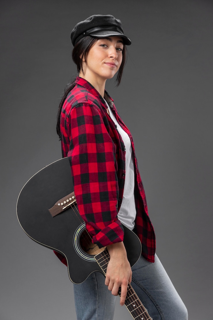 Gratis Foto portret vrouwelijke gitarist