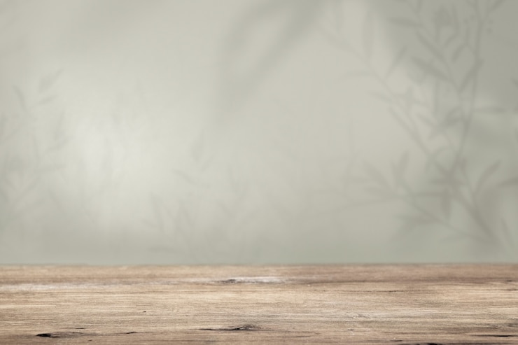 Gratis Foto productachtergrond, lege houten vloer met groene muur en plantenschaduw