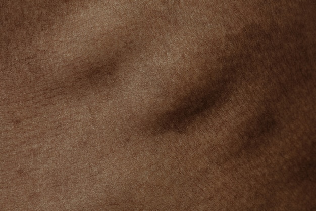 Ribben. Gedetailleerde textuur van de menselijke huid. Close-up shot van jonge Afro-Amerikaanse mannelijke lichaam. Huidverzorging, lichaamsverzorging, gezondheidszorg, hygiëne en geneeskundeconcept. Ziet er mooi en verzorgd uit. Dermatologie.