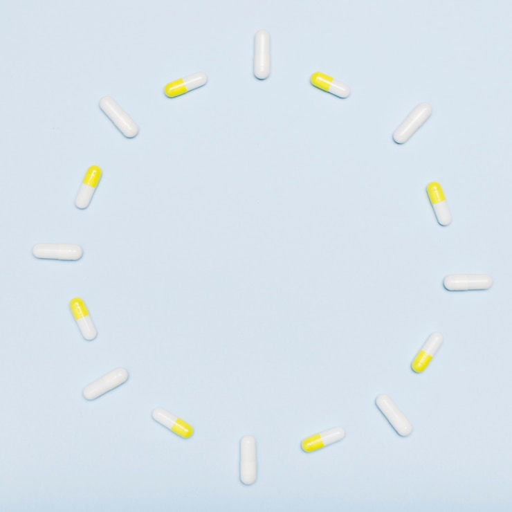 Gratis Foto rond frame gemaakt met capsules