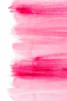 Gratis foto roze penseelstreek geïsoleerd op grunge achtergrond