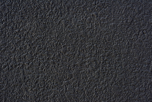 Ruwe zwarte cementgeplaste muurtextuur