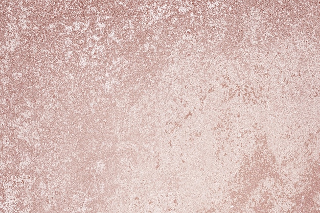 Ruwweg roze goud geverfd betonnen muuroppervlak