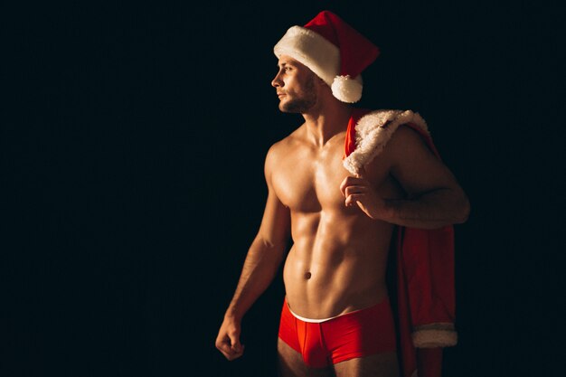 Sexy santa man naakt op zwarte achtergrond