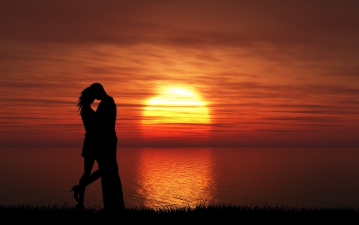 Gratis Foto silhouet van een paar kussen tegen een zonsondergang hemel