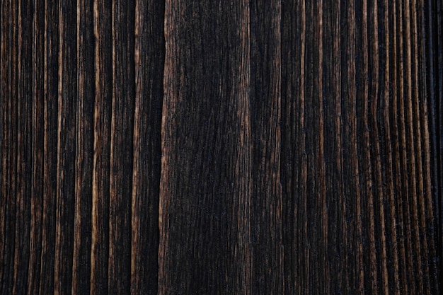 Sluit omhoog van donkere bruine houten textuur met natuurlijke gestreepte achtergrond