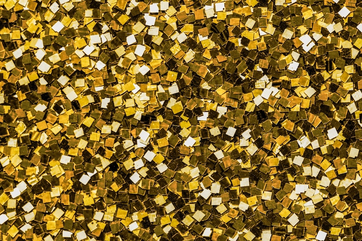 Gratis Foto sluit omhoog van gouden lovertjeachtergrond