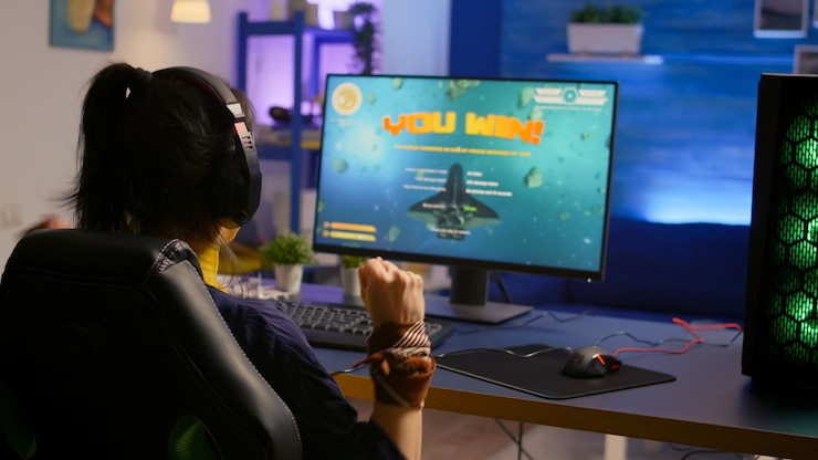 Gratis Foto speler winnen space shooter esport-toernooi met professionele headset