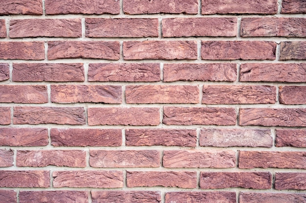 Stenen muur. Textuur van rode baksteen met witte vulling